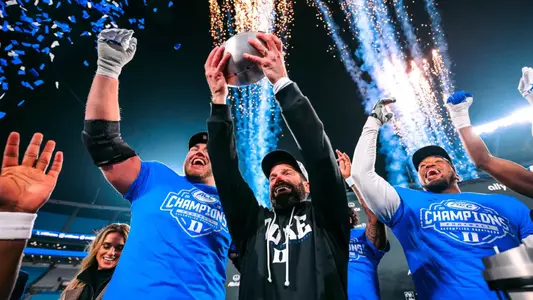 Duke football celebrates winning the ACC Championship game