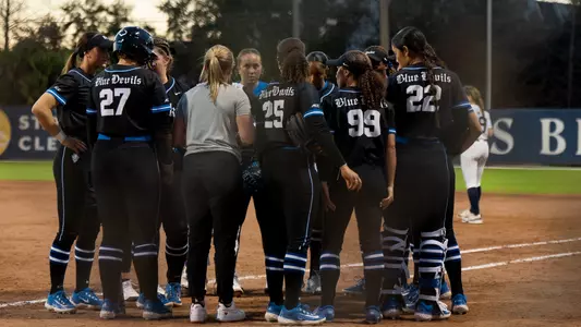softball huddle vs Penn State at NFCA Leadoff Classic