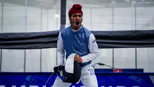 Dayaal Singh looks at the camera, celebrates and yells in reaction to a bout.