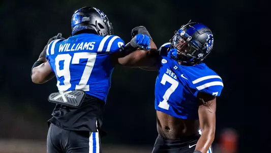 Wesley Williams and Vincent Anthony Jr. celebrate a play against Florida State.