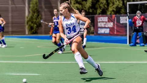 Brynn Crouse dribbles down the field against American in Washington DC