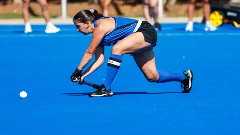 Macy Szukics sweeps the ball