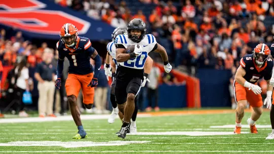 Duke freshman running back Nate Sheppard springs away from Syracuse defenders en route to a record-setting performance on September 27, 2025.