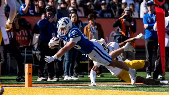 Duke tight end Jeremiah Hasley, wearing a white helmet, blue jersey and white pants, dives for the end zone during the 2025 Tony the Tiger Sun Bowl, which Duke won 42-39 against Arizona State inside Sun Bowl Stadium.