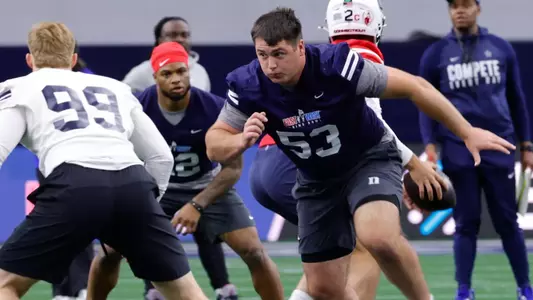 Former Duke All-America offensive lineman Brian Parker II takes a jog through a rep during a practice for the East-West Shrine Game.
