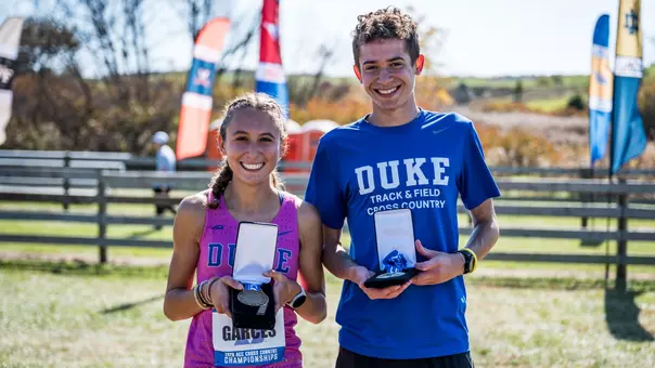 Victoria Garces and Finlay Ross-Davie hold ACC medals