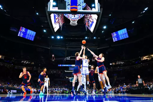 Cayden Boozer (No. 2) attempts a contested shot in the lane between two Virginia defenders during Duke’s 74-70 win in the ACC Championship on March 14, 2026, at the Spectrum Center.