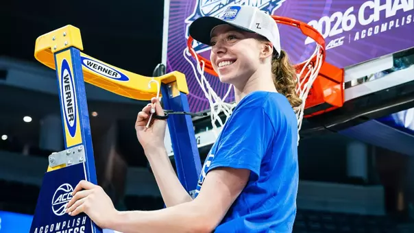 Toby Fournier cuts down the net after Duke won the 2026 ACC women’s basketball championship.