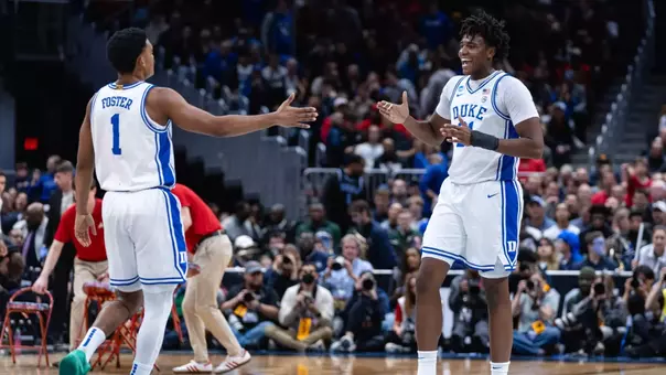 Caleb Foster and Patrick Ngongba celebrate against St. John's