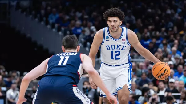 Cameron Boozer dribbles against UConn