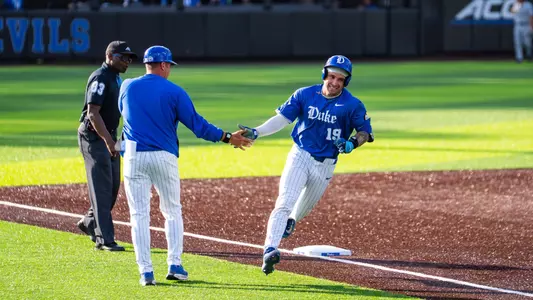 Michael DiMartini celebrates a home run against Davidson