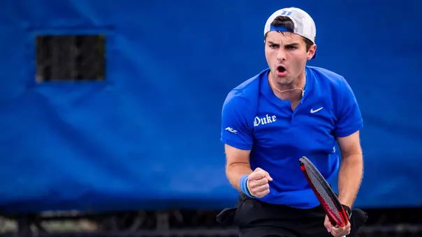 Duke men's tennis' Alexander Visser fist pumps and yells in celebration during the Blue Devils' 4-0 victory against NC State on March 27, 2026.