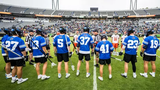 Duke men's lacrosse starting lineup at handshake with Princeton prior to faceoff