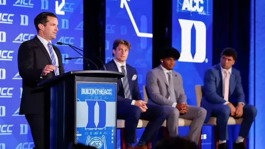 Duke football head coach stands at a podium during 2026 ACC Football Kickoff