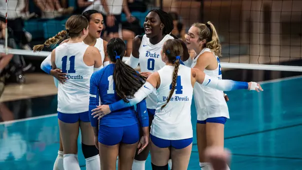 Duke volleyball huddles after a point in its season opening win over Coastal Carolina on August 28