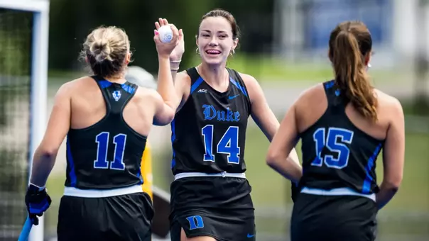 Alaina McVeigh high fives teammate Lily Soldan after scoring a goal
