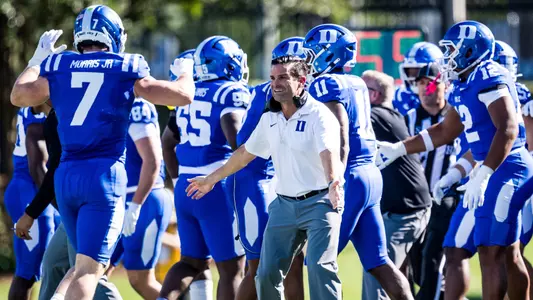 Duke head coach Manny Diaz congratulates the defense during Duke's 62-7 victory against William & Mary on September 26, 2026.