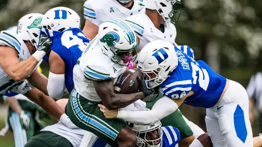 Duke linebacker Bradley Gompers, wearing a white helmet, blue jersey and white pants, makes a tackle against Tulane on September 5, 2026.