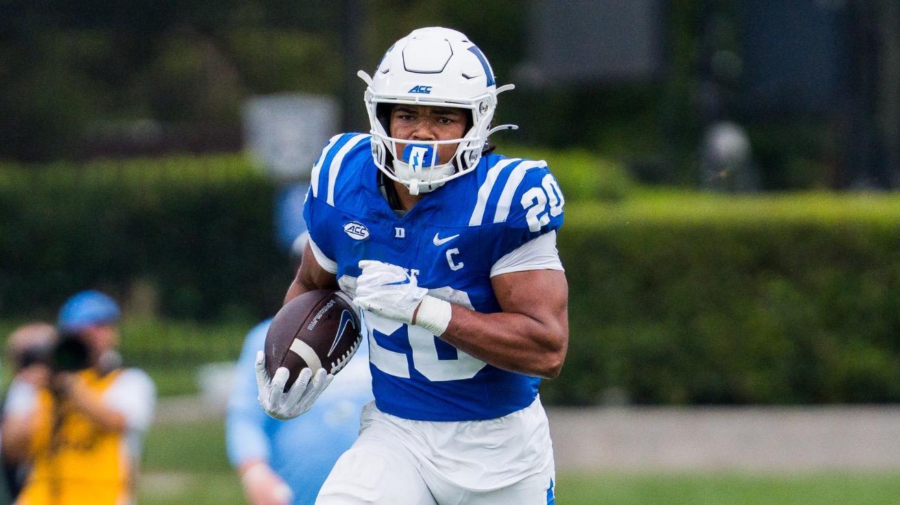 Duke running back Nate Sheppard, wearing a white helmet, blue jersey and white pants, holds the ball and runs against Tulane on September 5, 2026.