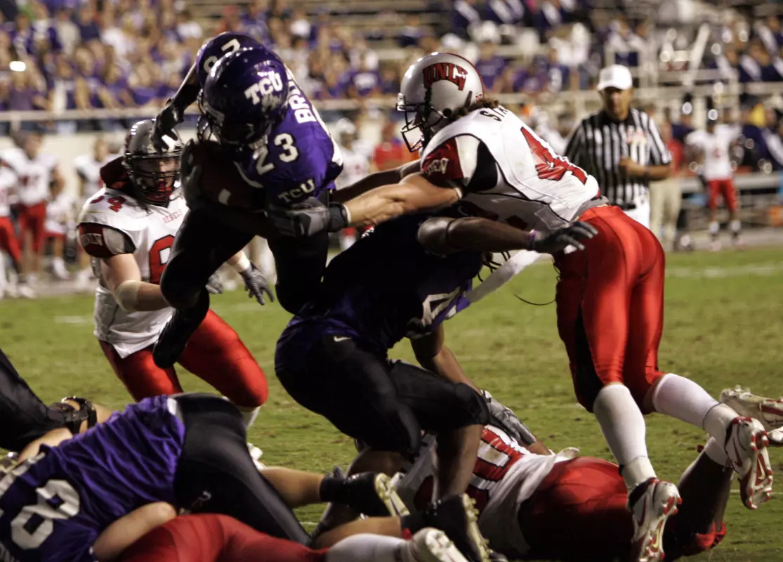 TCU tailback Aaron Brown (23) dives into the end zone for a touchdown in the second quarter. (AP Photo/Donna McWilliam)