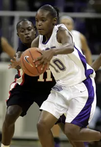 Georgia guard Sherill Baker (11) reaches for the ball against TCU guard Moneka Knight (10) in the first half. (AP Photo/Donna McWilliam)