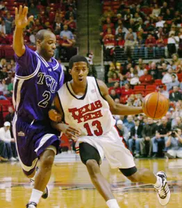 Brent Hackett guards Texas Tech's Terry Martin (13) as he drives with the ball during the first half. (AP Photo/Lubbock Avalanche-Journal, Joe Don Buckner)