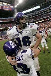TCU quarterback Jeff Ballard (16) is lifted by teammate Jared Retkofsky (83) as they celebrate their 27-24 win over Iowa State in the EV1.net Houston Bowl. (AP Photo/David J. Phillip)