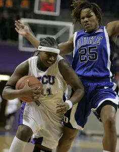 TCU guard Natasha Lacy drives to the basket against Duke's Monique Curry. (AP Photo/Donna McWilliam)