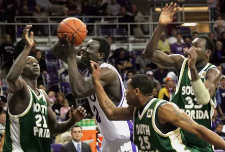 TCU's Femi Ibikunle is surrounded by South Florida's Terrence Leather and James Holmes. (AP Photo/Fort Worth Star-Telegram, Joyce Marshall)