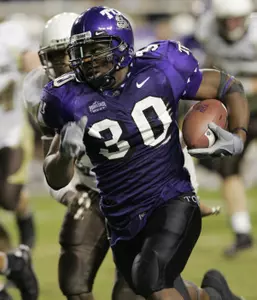 Lonta Hobbs runs for a 6-yard gain in the second half. (AP Photo)