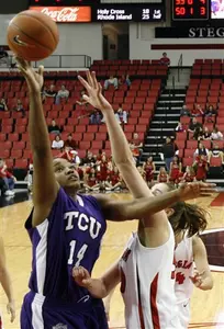 TCU's Lorie Butler-Rayford, left, lays up a shot over Georgia's Rebecca Rowsey, right, during the first half. (AP Photo)