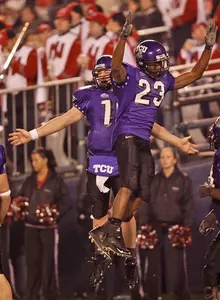 TCU quarterback Jeff Ballard and tailback Aaron Brown (23) celebrate after TCU's fourth touchdown against Northern Illinois during the third quarter. (AP Photo)