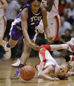 New Mexico's Julie Briody, right, comes up short after diving for a loose ball while being pursued by TCU's Adrianne Ross. (AP Photo/Jake Schoellkopf)