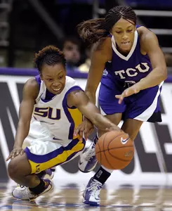 Louisiana State's Khalilah Mitchell, left, dives for a loose ball with TCU's Adrianne Ross, right, during the second half. (AP Photo/Bill Feig)