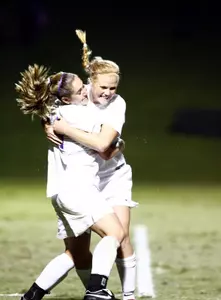 Lizzy Karoly and Nikki Wilbur celebrate a goal against nationally ranked Utah.
