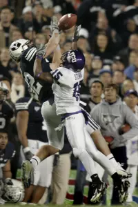 Brigham Young tight end Dennis Pitta (32) pulls in a 32-yard pass for a first down against TCU cornerback Torrey Stewart (15) during the first quarter. (AP Photo/Douglas C. Pizac)