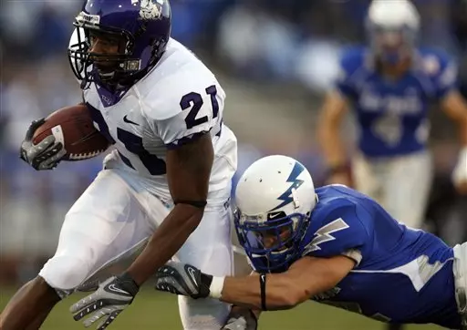 TCU wide receiver Ervin Dickerson, left, slips past Air Force cornerback Carson Bird after Dickerson pulled in a pass in the second quarter. (AP Photo/David Zalubowski)