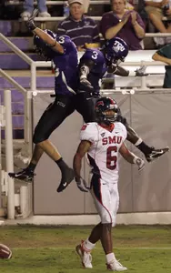 Wide receiver Derek Moore celebrates his touchdown rception with teammate Marcus Brock as SMU defensive back Bryan McCann walks away in the second quarter. (AP Photo/Donna McWilliam)