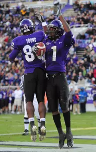 Jimmy Young and Walter Bryant celebrate after a touchdown.