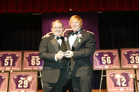 TCU senior linebacker James Gleaton, with head coach Gary Patterson, received the Y.Q. McCammon Outstanding Squadman Award.