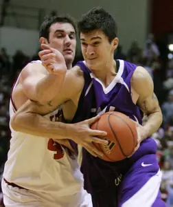 TCU center Zvonko Buljan, right, drives to the basket against Indiana forward Kyle Taber during the first half. (AP Photo/Darron Cummings)