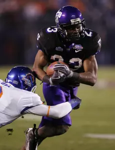 Aaron Brown breaks past Boise State's George Iloka. (AP Photo/Denis Poroy)