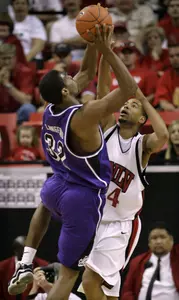 TCU's Kevin Langford tries to shoot over UNLV's Rene Rougeau.