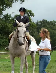 Tassie Munroe earned a win in Equitation over Fences with a score of 82.