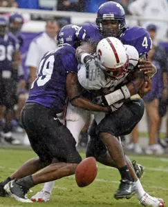 TCU's Corderra Hunter, left, and Daryl Washington break up a pass intended for Stanford's Richard Sherman during the third quarter. (AP Photo/Fort Worth Star-Telegram, Sharon M. Steinman)