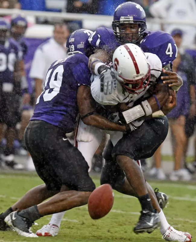 TCU's Corderra Hunter, left, and Daryl Washington break up a pass intended for Stanford's Richard Sherman during the third quarter. (AP Photo/Fort Worth Star-Telegram, Sharon M. Steinman)