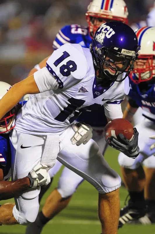 Ryan Christian fights off SMU players in Saturday's game.