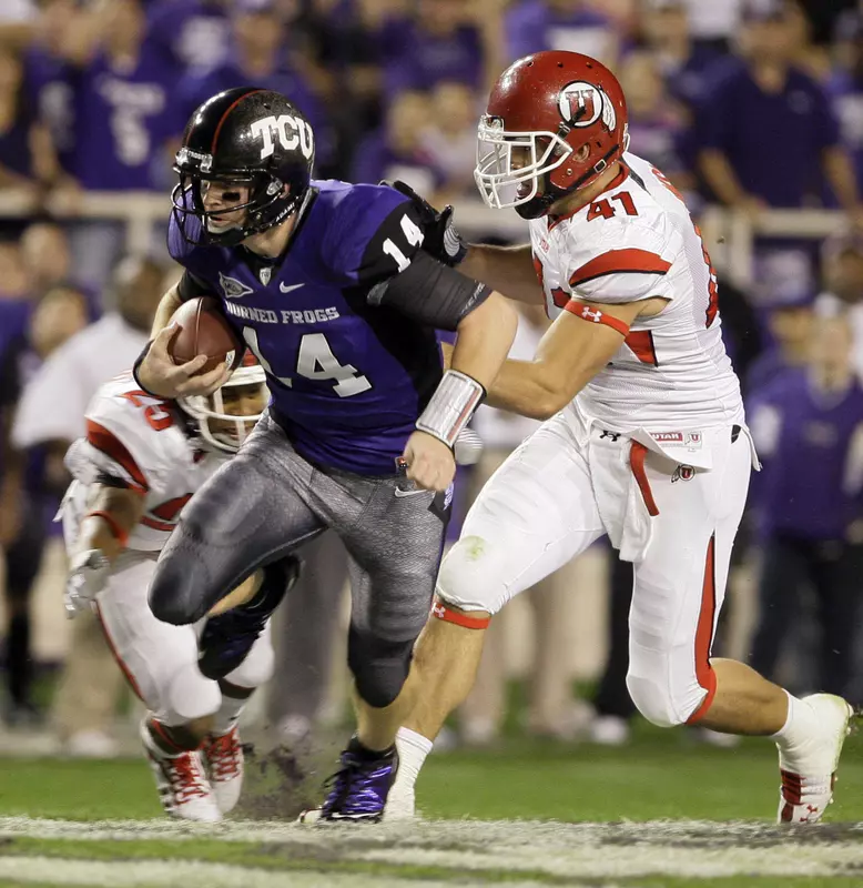 Andy Dalton runs for a gain of 12 yards against Utah defensive back R.J. Stanford and defensive end Koa Misi.