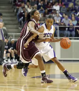 TCU guard Antoinette Thompson, right, drives the the basket against Texas A&M.
