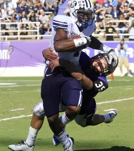BYU wide receiver O'Neill Chambers, left, is tackled by Tanner Brock.